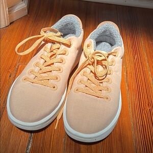 Peach allbirds with Orange Laces